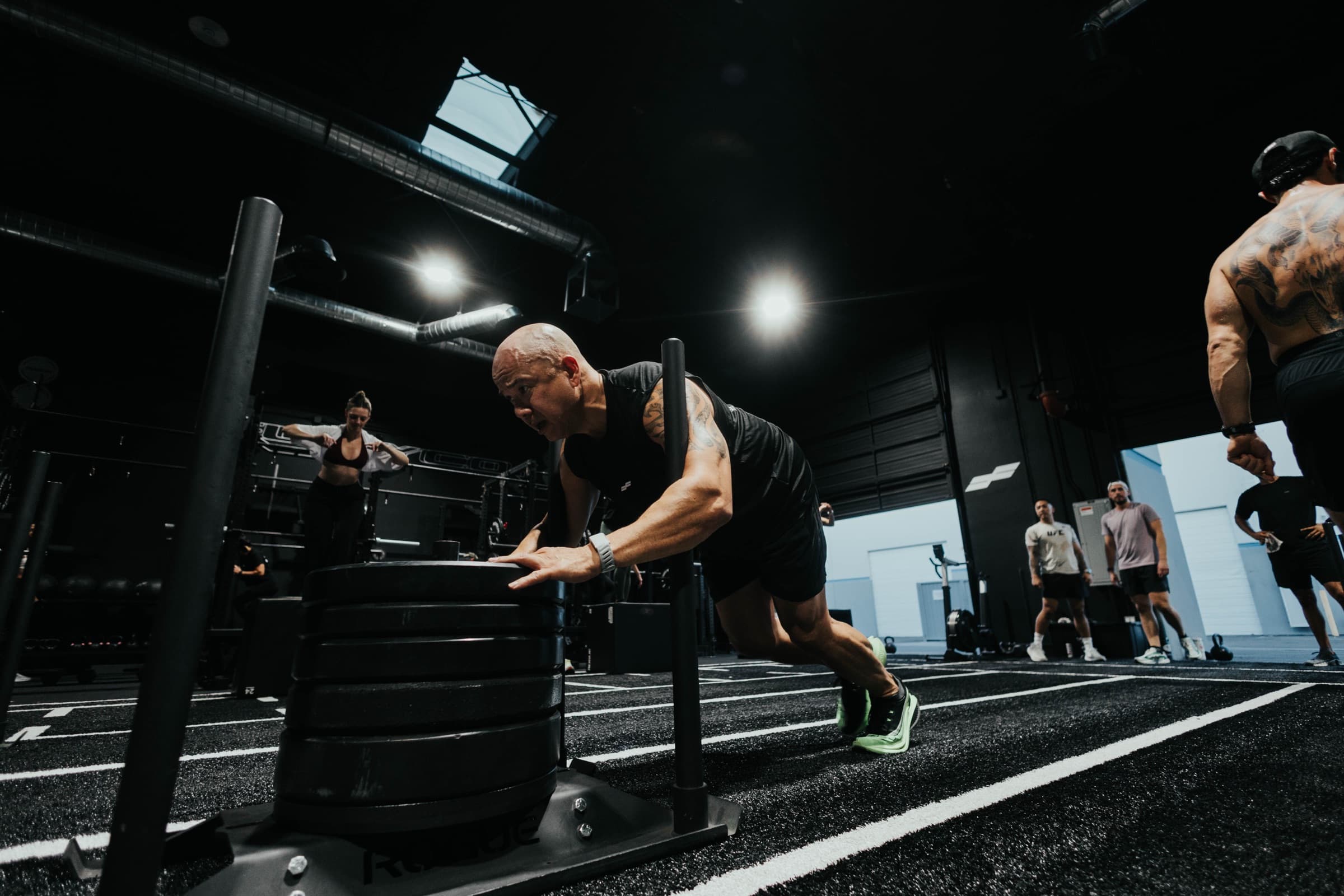 An athlete pushing a loaded sled at Fury Co Athletics