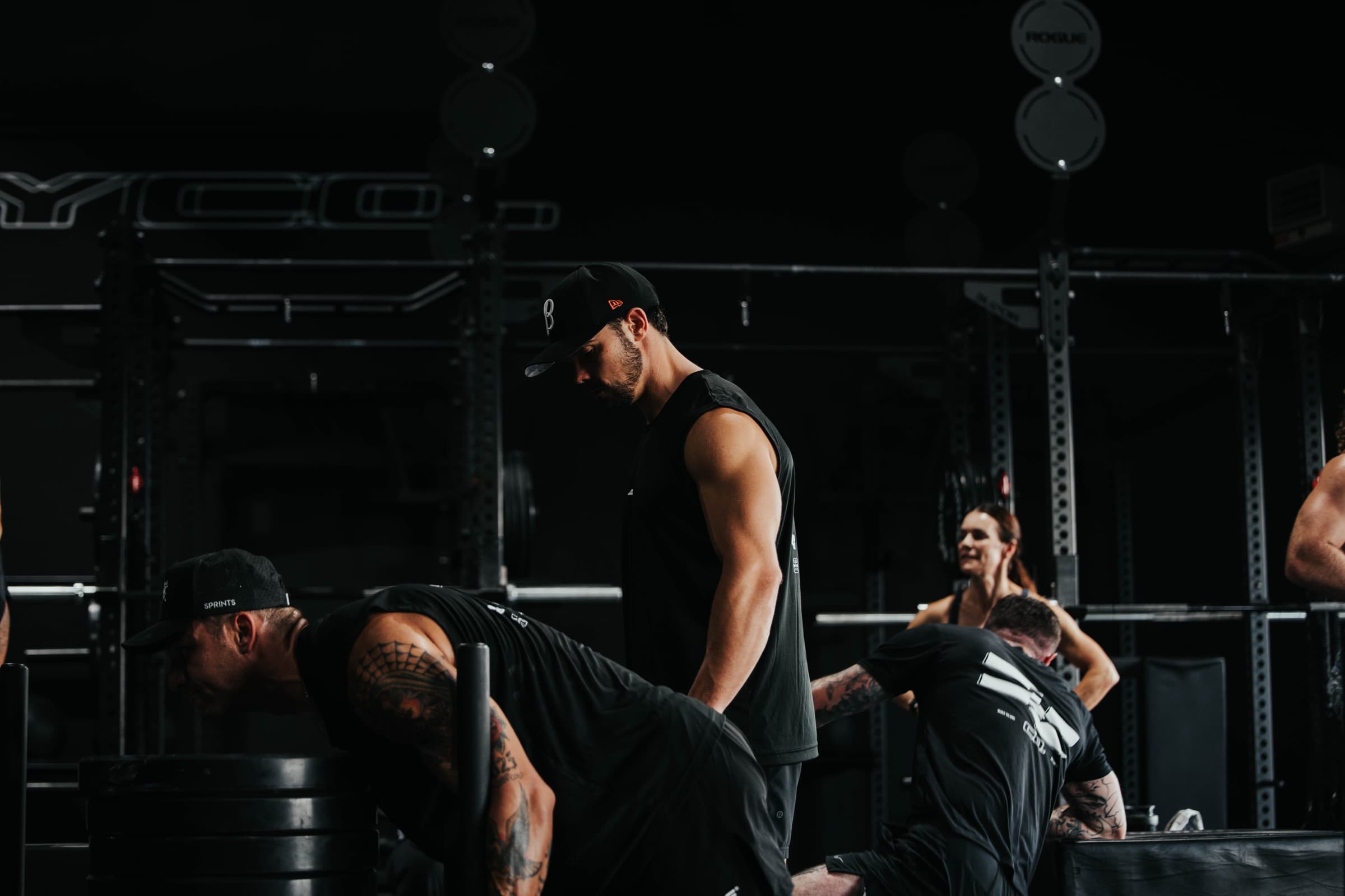 A coach refining an athlete's lift